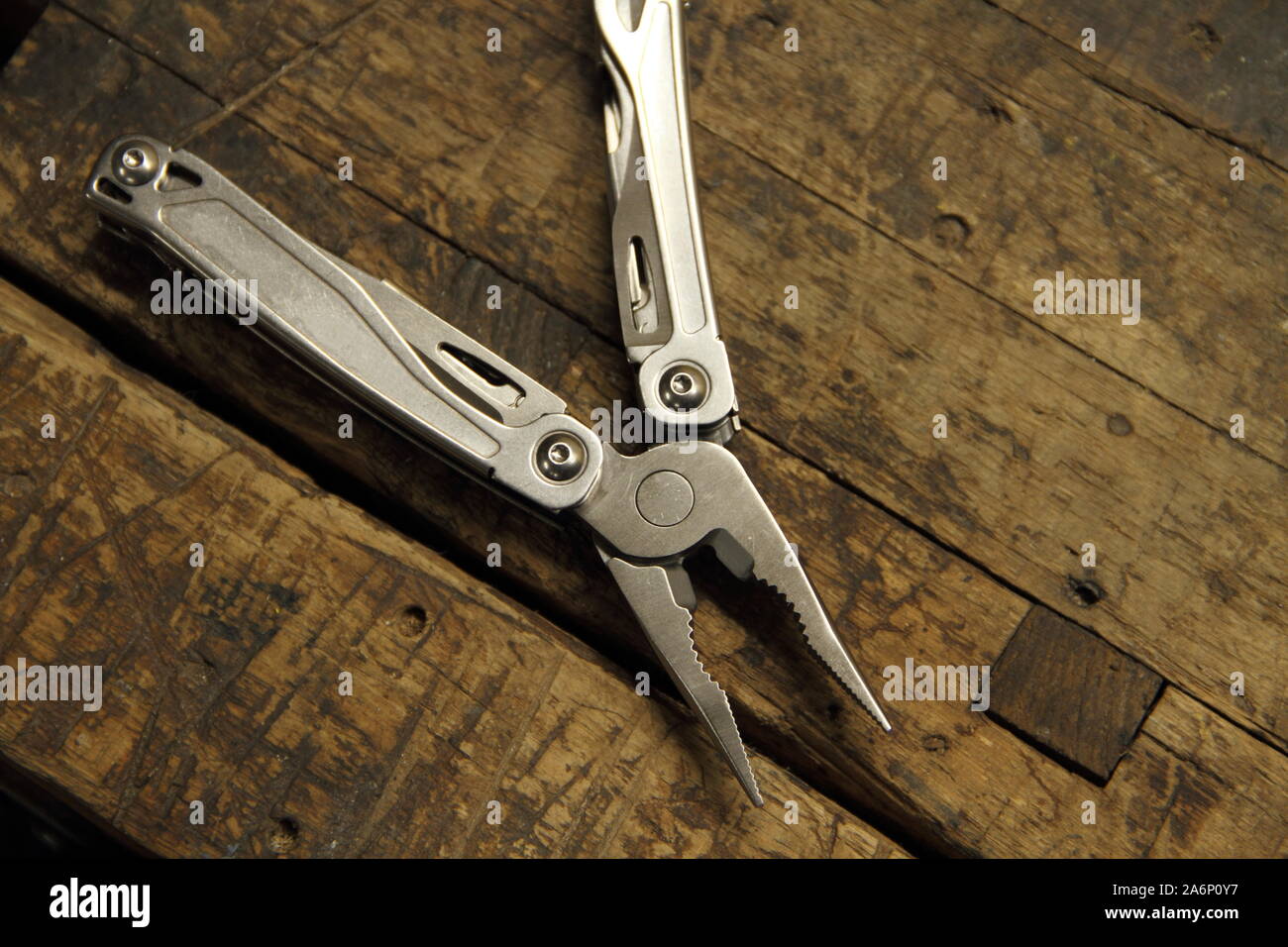 a multitool on the workbench Stock Photo