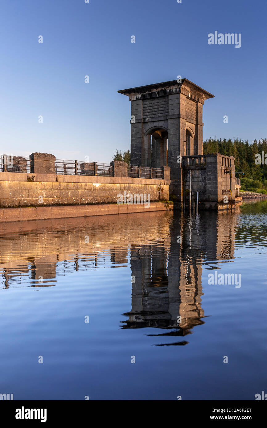 Alwen reservoir dam with reflection, North Wales on a sunny afternoon Stock Photo