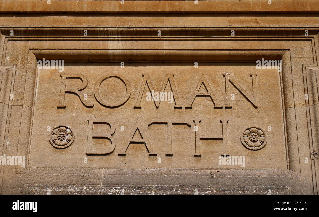 Roman Bath sign carved in stone, Bath, Somersetshire, Avon, England, United Kingdom Stock Photo