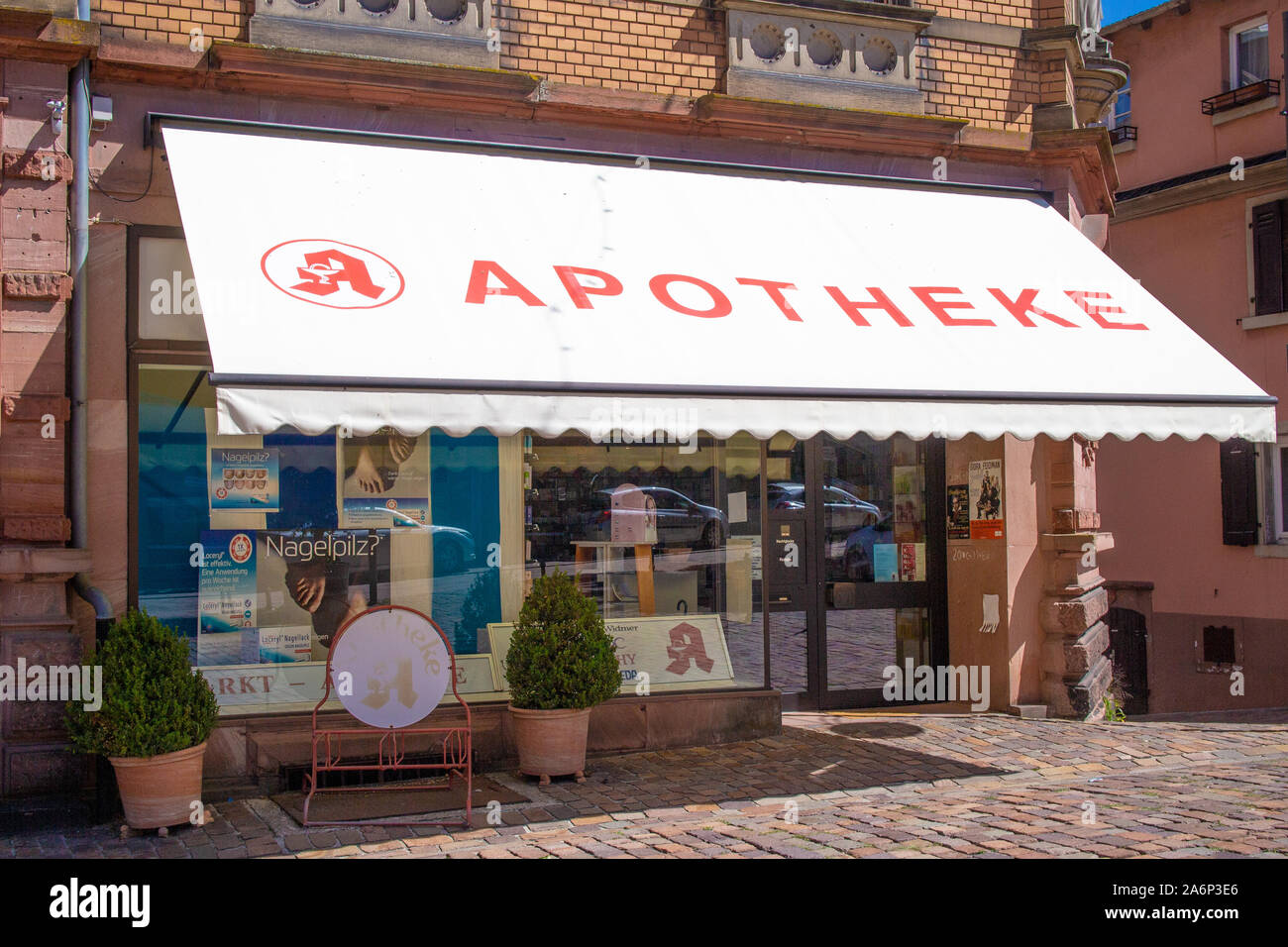 Neckargemünd, Germany - August 18, 2019: Exterior view of a pharmacy in Neckargemünd, Southern Germany with sun protection sail Stock Photo