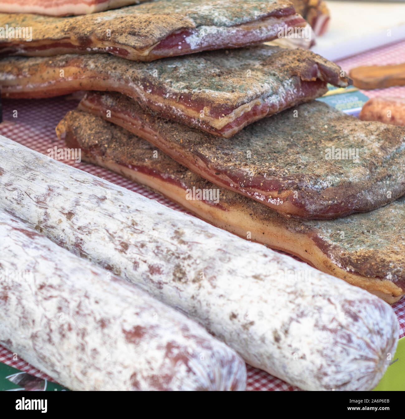 Italian artisan salami seller in a local market Stock Photo Alamy