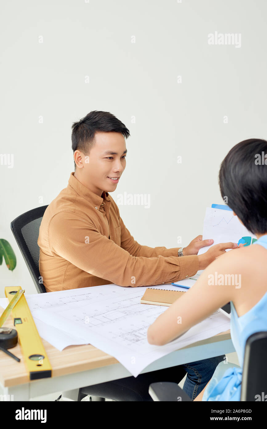 Cheerful two architects are discussing new project Stock Photo