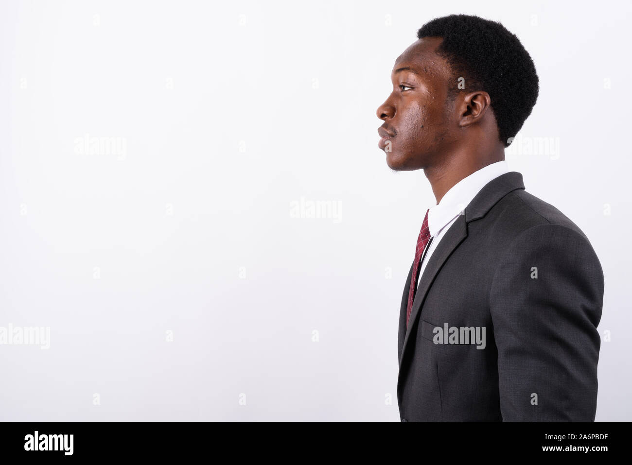 Young handsome African businessman wearing suit against white ba Stock ...