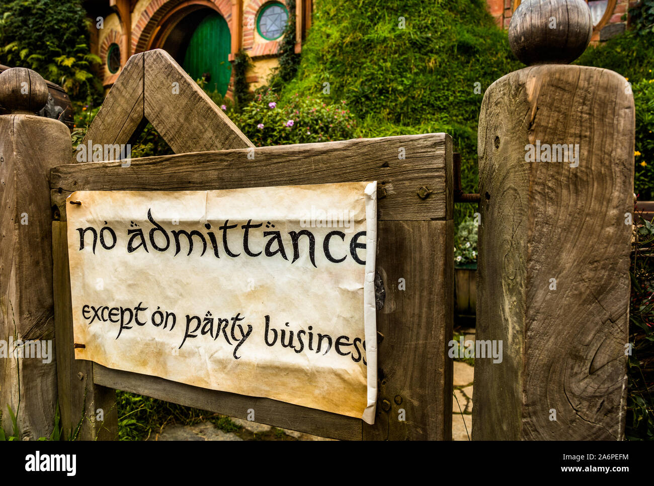 Entrance to Bag End (Bilbo Baggin's Hobbit Hole) and Sign pertaining to Bilbo's 111th birthday party. Hobbiton Movie Set, Matamata, New Zealand Stock Photo