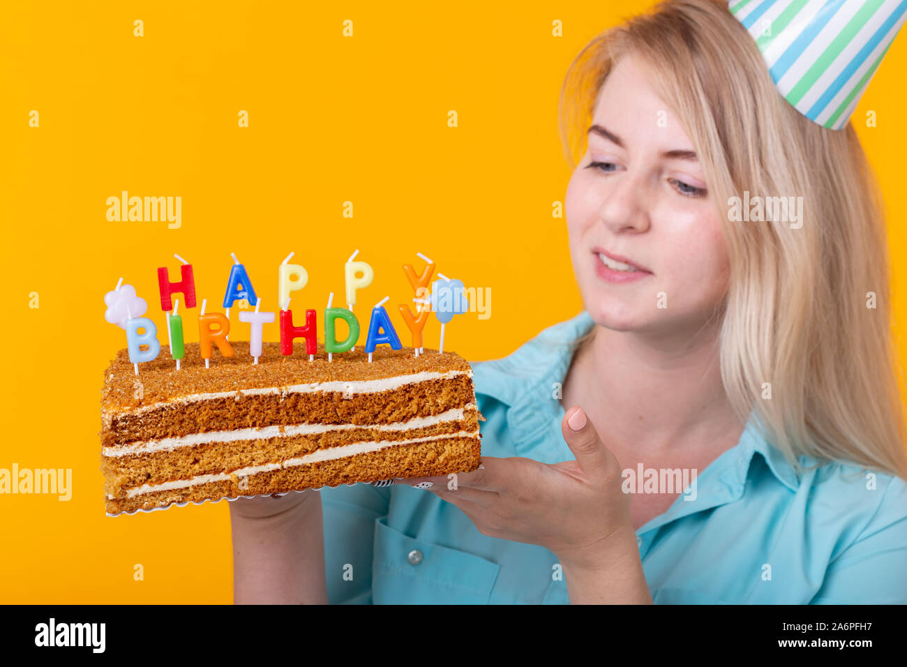Holidays and party cocept - Close-up of positive young woman holding a ...