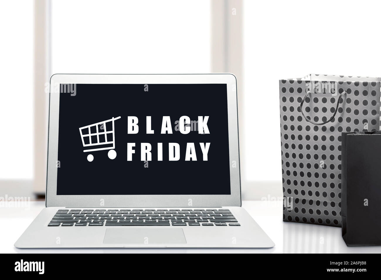 Black Friday advert on the laptop screen on the desk. Black Friday concept Stock Photo Alamy