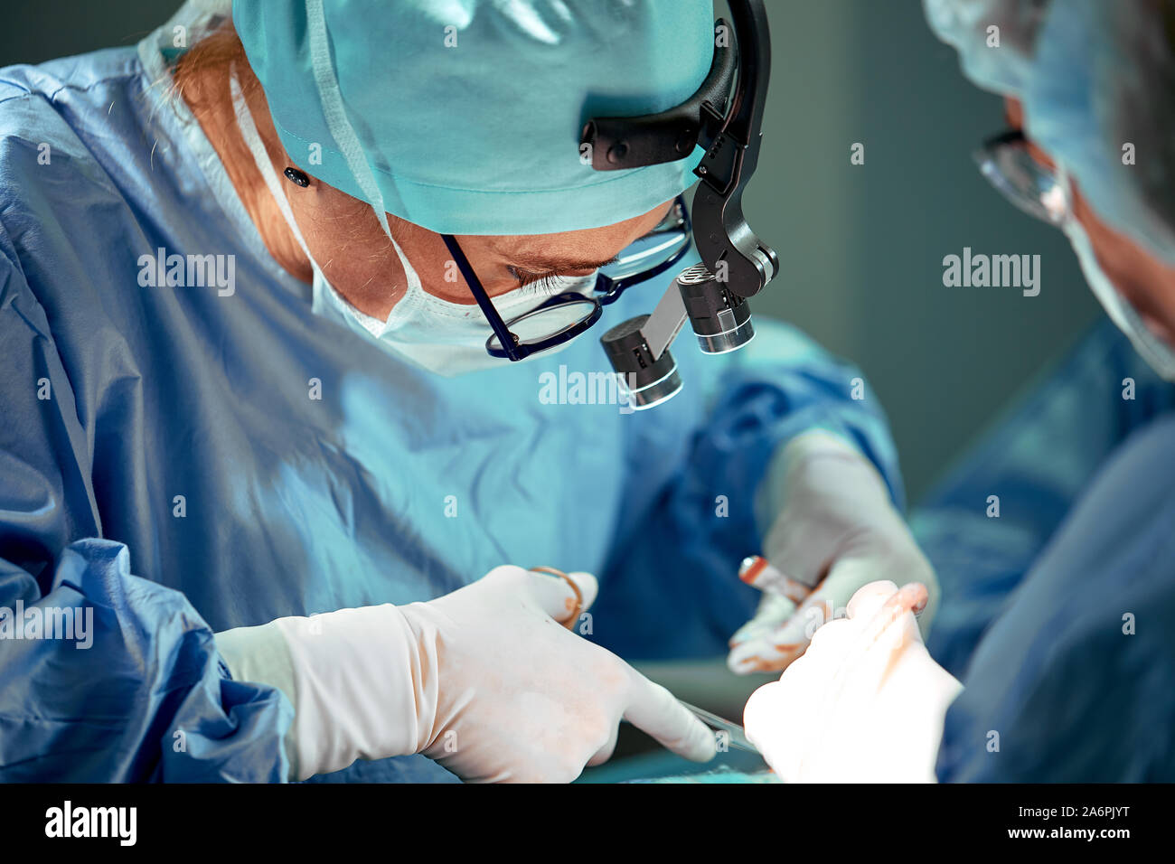 Portrait of a team of surgeons at work. During surgery. Concept ...