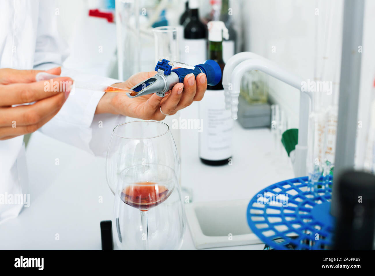 View on good hands working in chemical laboratory checking wine