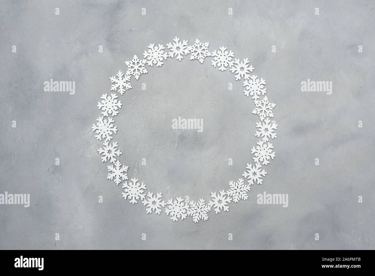 White christmas round snowflakes frame with place for text on the grey ...