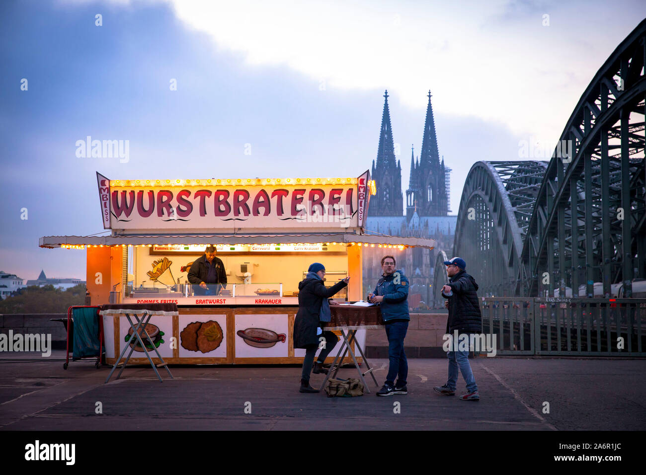 the sausage roastery at the Hohenzollern bridge in Deutz, known from the Cologne TV crime series Tatort, view to the cathedral, Cologne, Germany.  die Stock Photo
