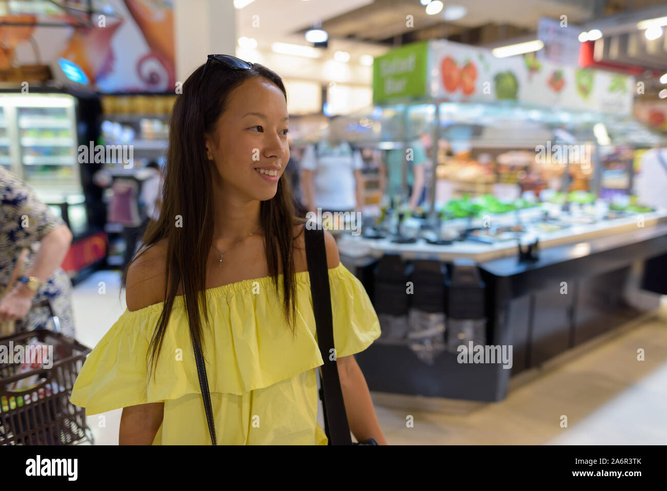 Young beautiful tourist woman exploring the city of Bangkok Stock Photo