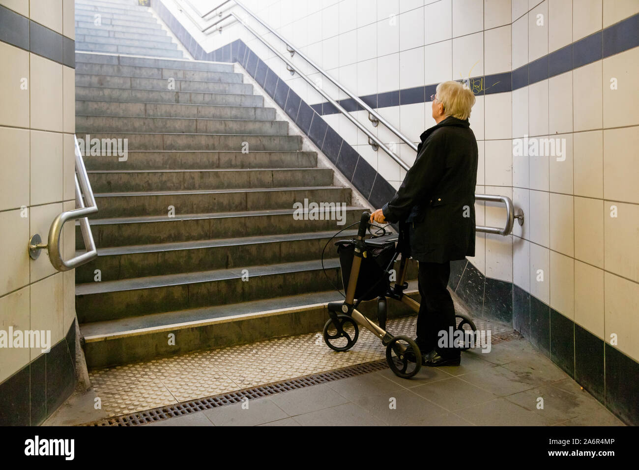 Elderly woman walker stairs hi-res stock photography and images - Alamy