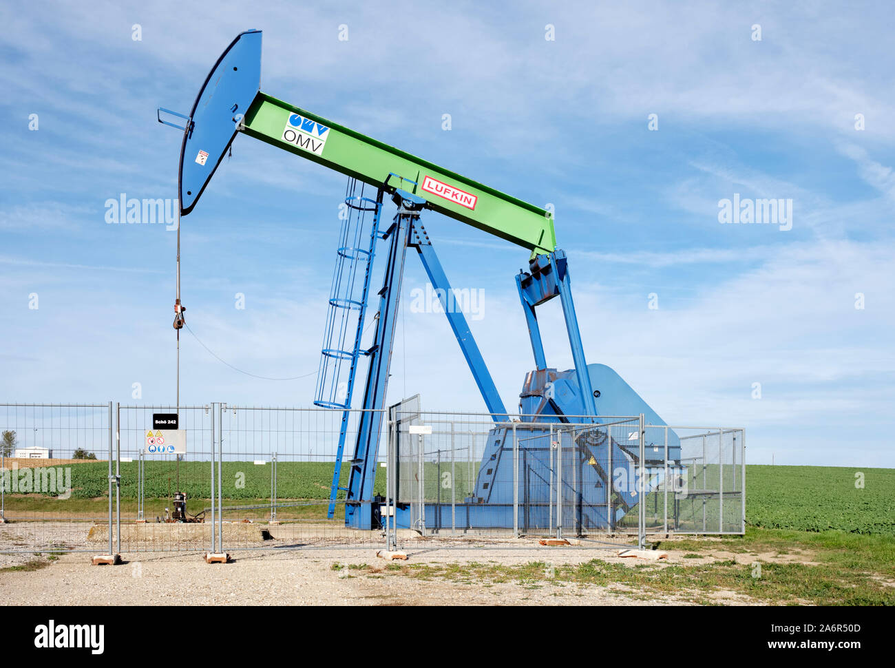 OMV pump jack mining crude oil in the Weinviertel region of lower Austria (Niederosterreich) Stock Photo
