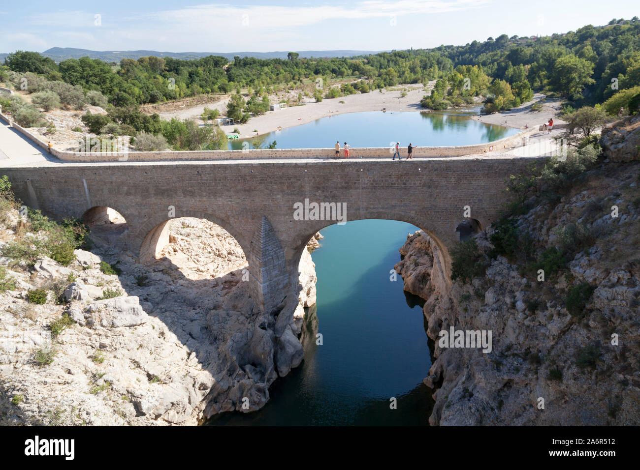 France, Languedoc, pont du Diable, the 11th century bridge at  the base of the gorge near the hill top village of St Guilhem le Desert. Stock Photo