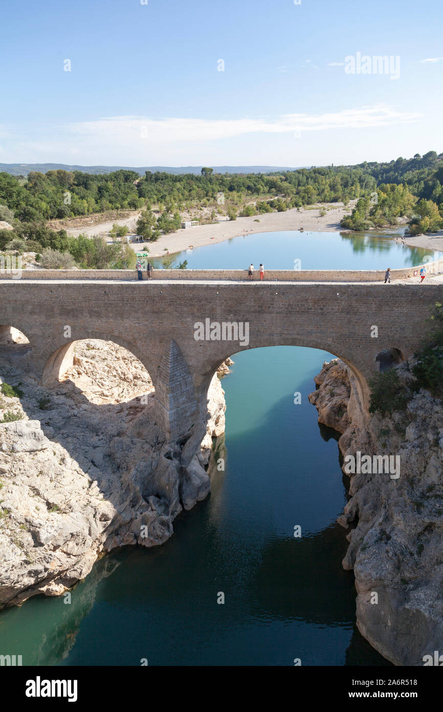 France, Languedoc, pont du Diable, the 11th century bridge at  the base of the gorge near the hill top village of St Guilhem le Desert. Stock Photo
