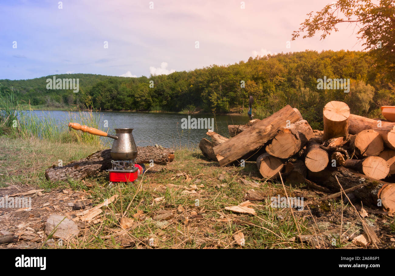 Outdoor coffee making in cezve on primus stove Stock Photo