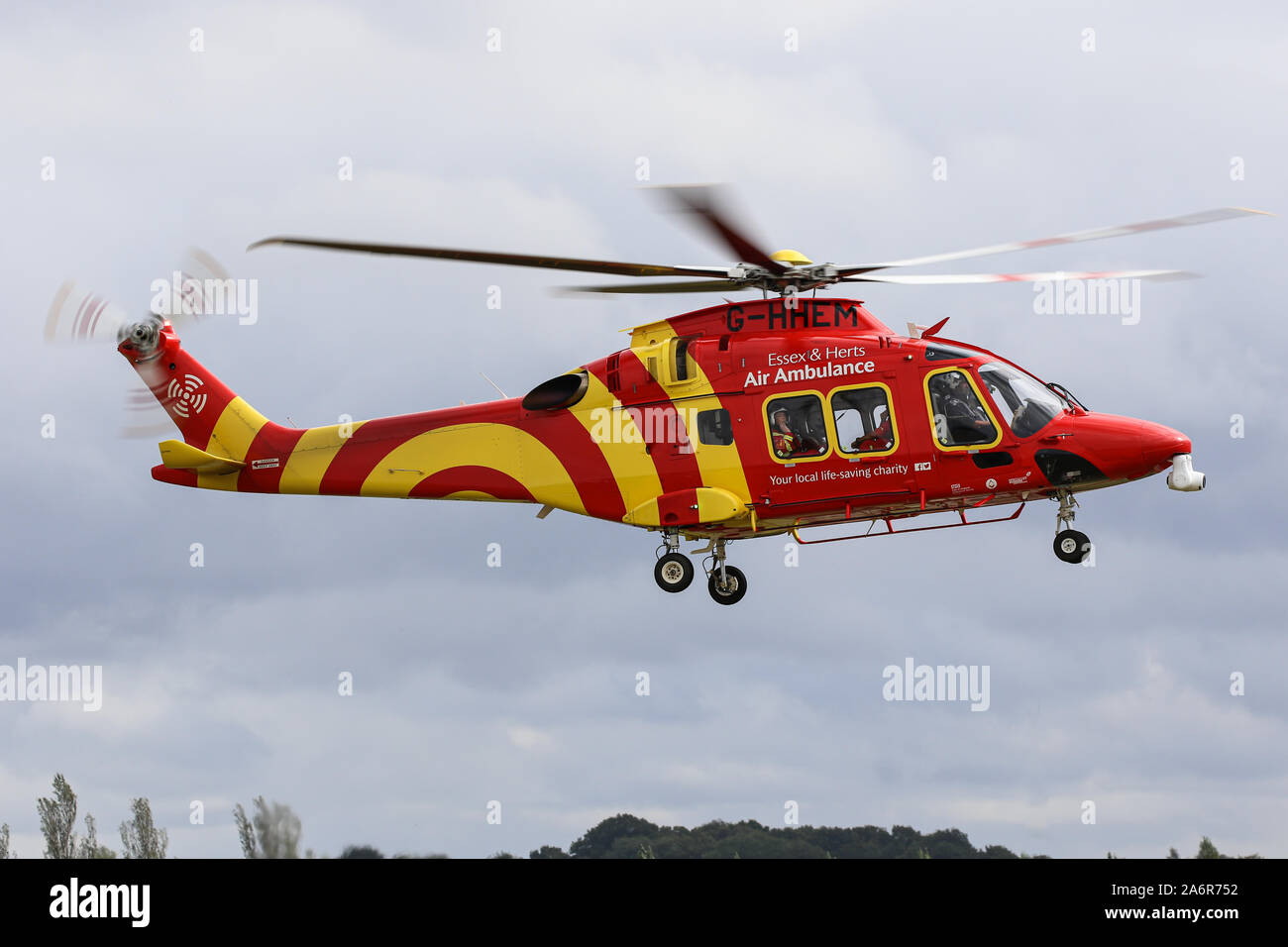 An AgustaWestland AW169 belonging to Essex & Herts Air Ambulance lands at North Weald Airfield Stock Photo