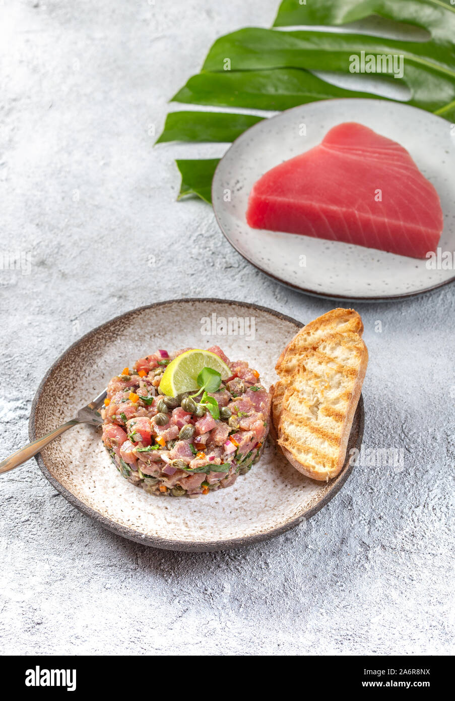 Tuna fish TARTAR tartare on gray plate Stock Photo Alamy