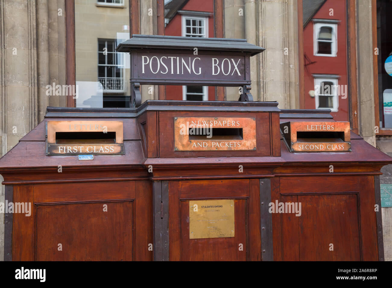 An old posting box or post box with brass letterboxes outside the main post office in St. Aldates, Oxford Stock Photo