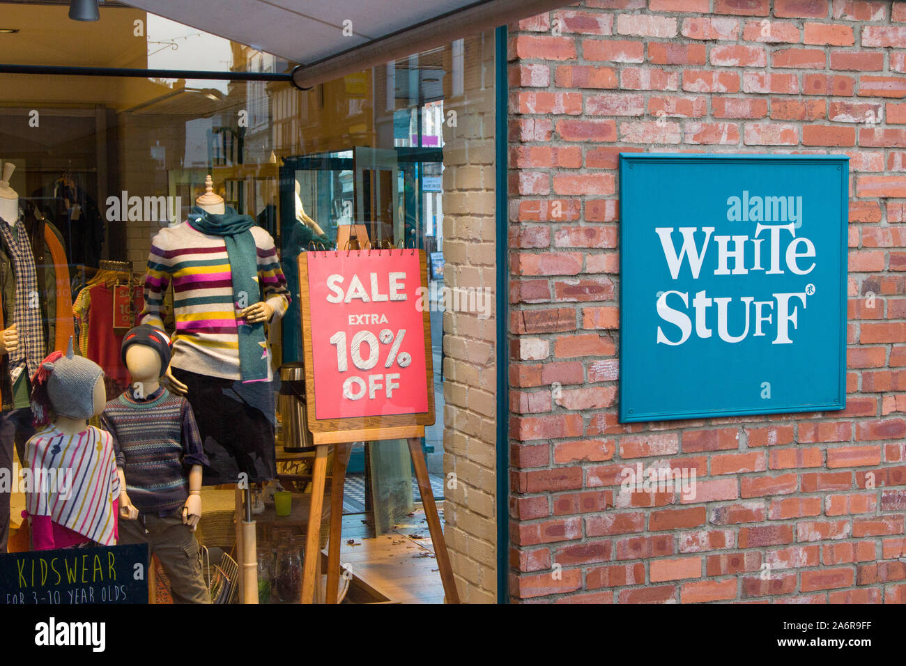 The shop window of the White Stuff clothing store in Henley-on-Thames with a sign for a sale 'Extra 10% Off' Stock Photo