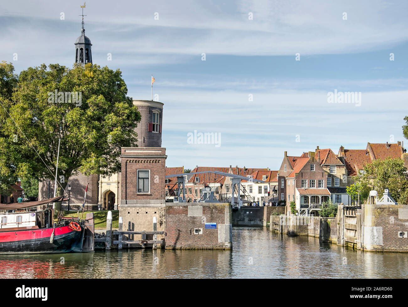 Enkhuizen, The Netherlands, September 13, 2019: view across the outer harbour towards the sluice and canal leading to the inner harbour and the old to Stock Photo