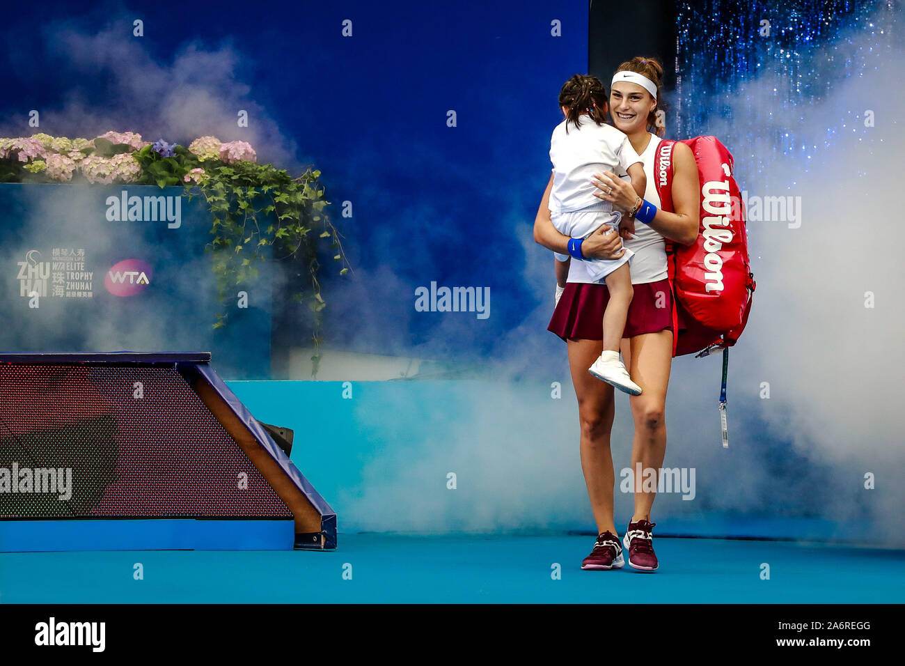 Aryna Sabalenka of Belarus holding her daughter arrives at the court