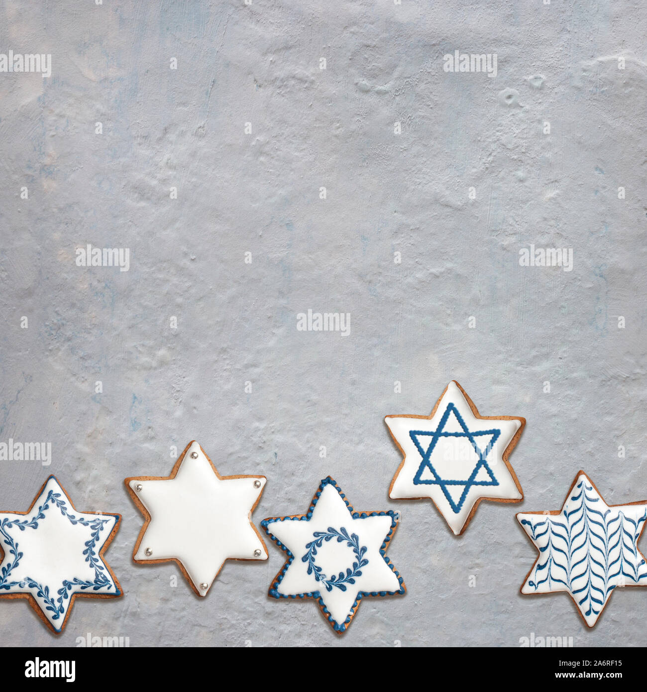 Star shaped artisanal gingerbread cookies for Chanukkah or Bar Mitzvah party. Empty space for your text. Stock Photo