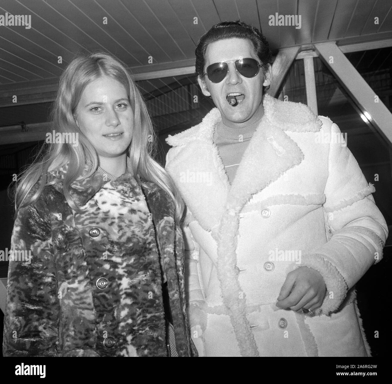 Rock singer Jerry Lee Lewis arrives at Heathrow from Chicago. He is to record a 24-track double album during a six-day visit. His travelling companion is Charlotte Bumps. Stock Photo