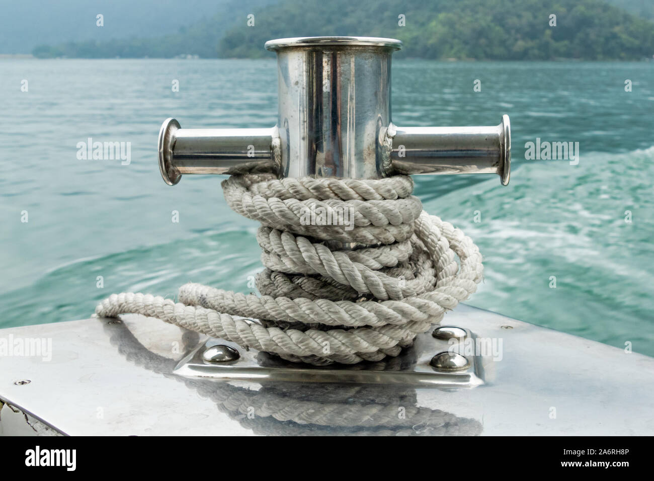Mooring post on small boat on beautiful green water Stock Photo