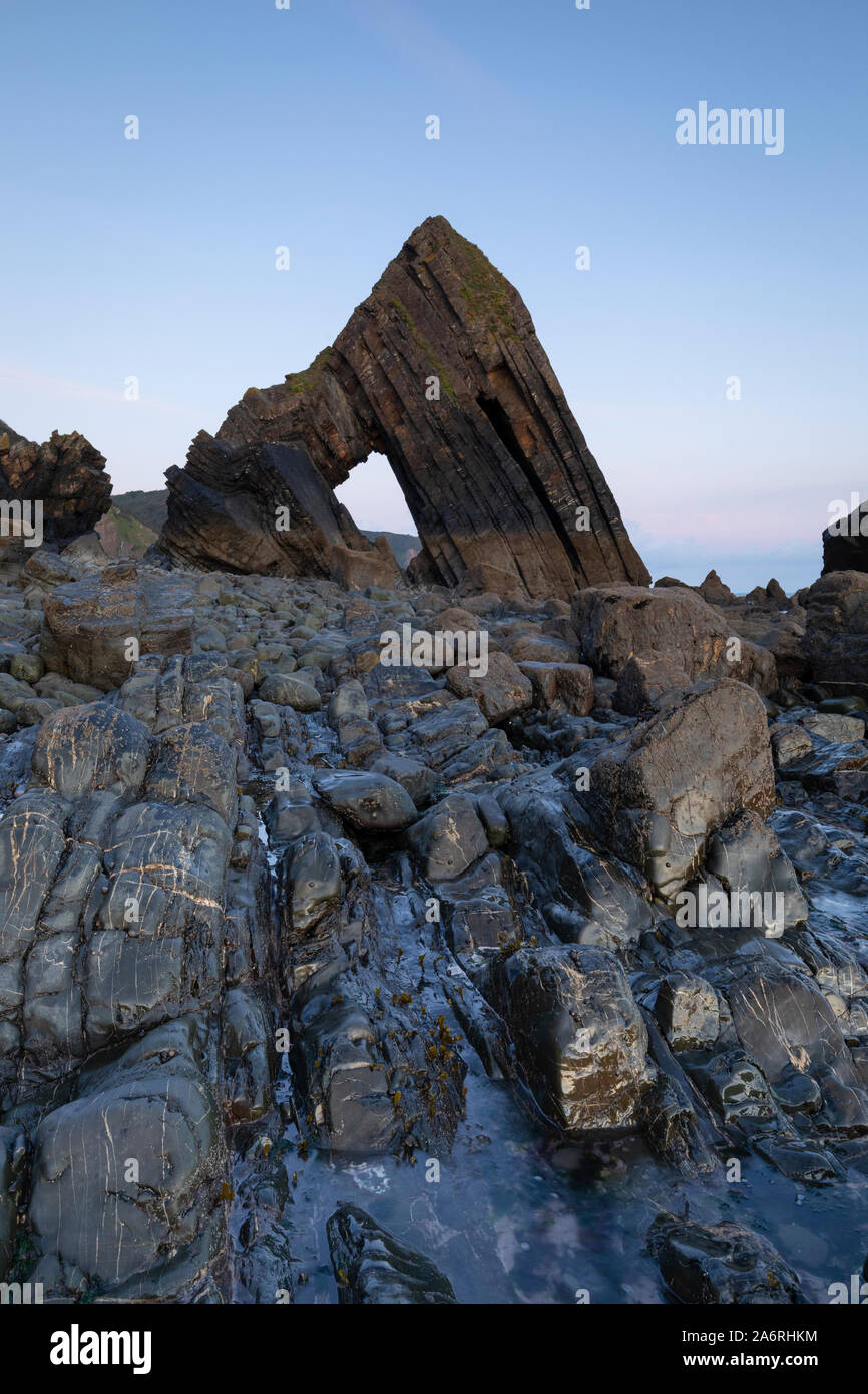 Blackchurch rock in North Devon. A natural stone arch rock formation on mouthmill beach. Stock Photo