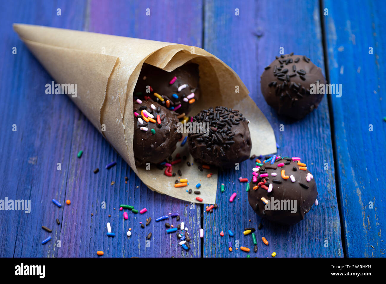Chocolate donut holes with sprinkles Stock Photo Alamy