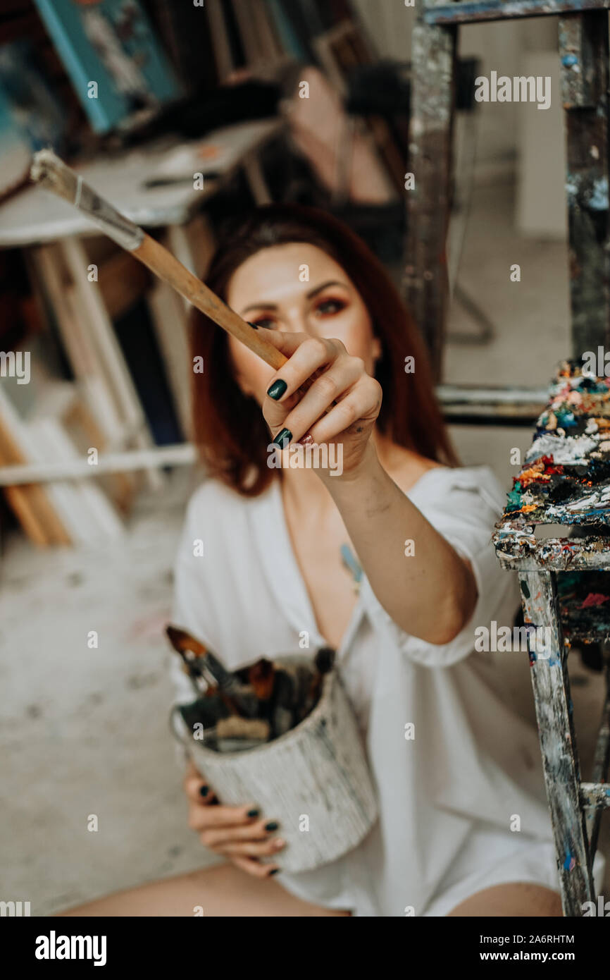 Smiling artist holding palette hi-res stock photography and images - Alamy