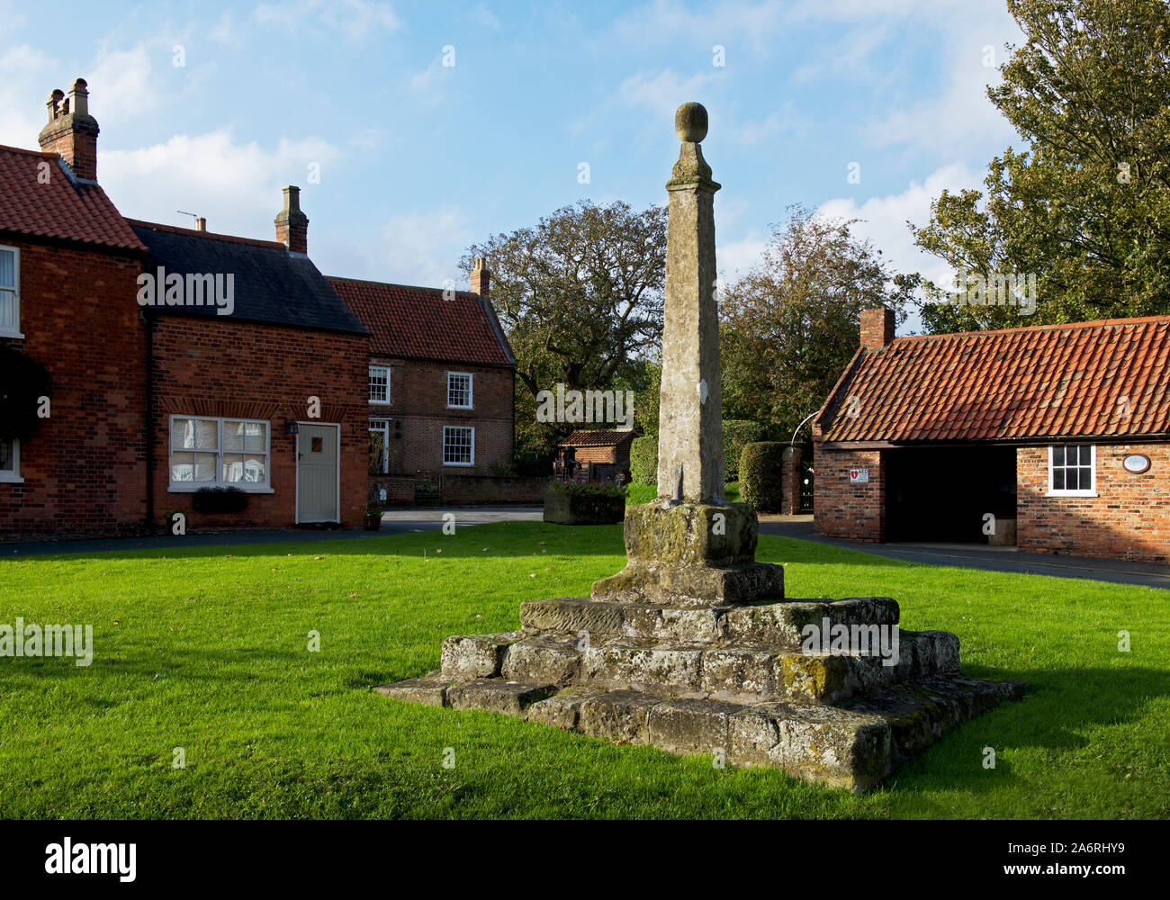 The market cross on the green, in the village of Lund, East Yorkshire