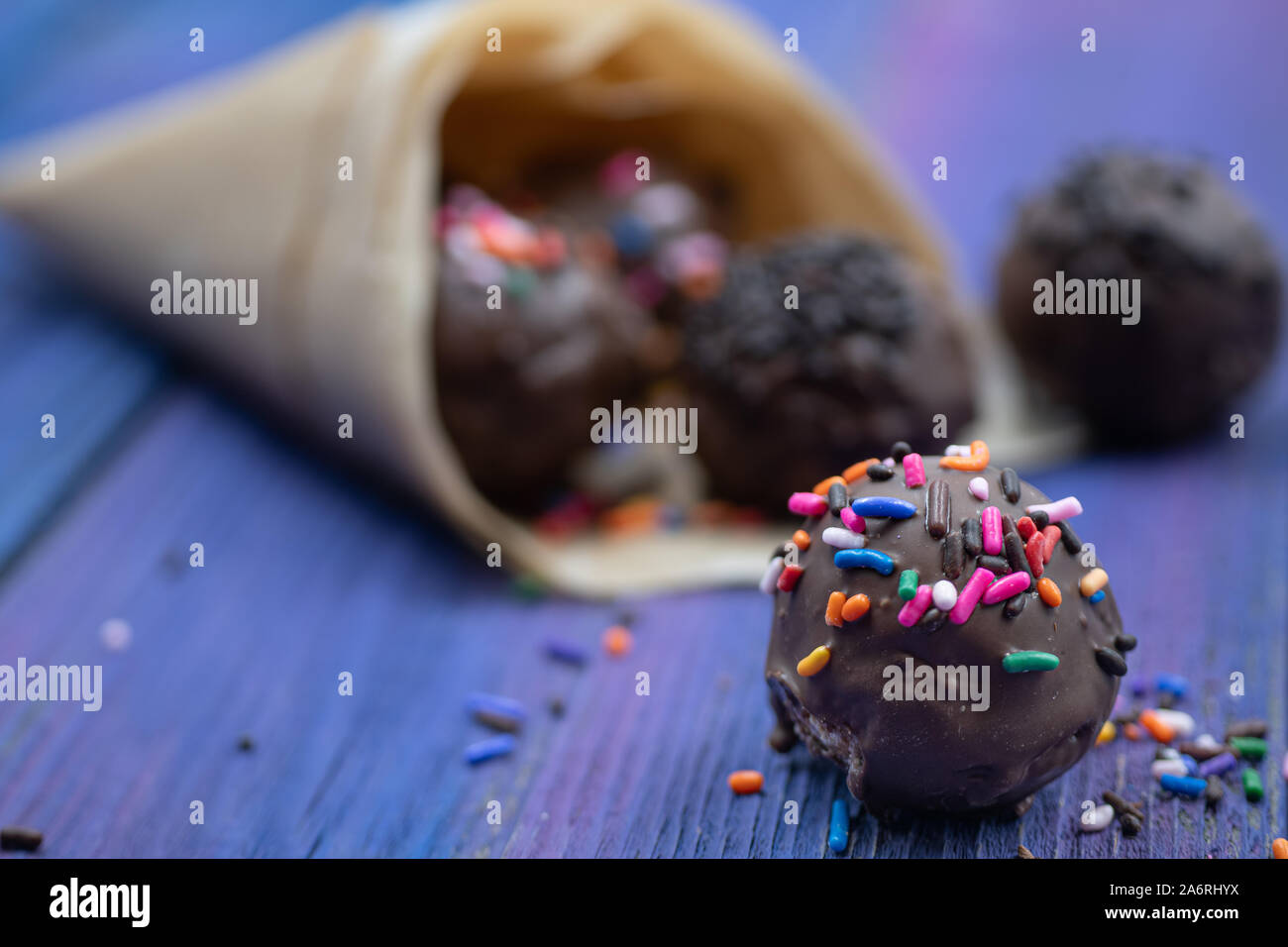 Chocolate donut holes with sprinkles Stock Photo Alamy