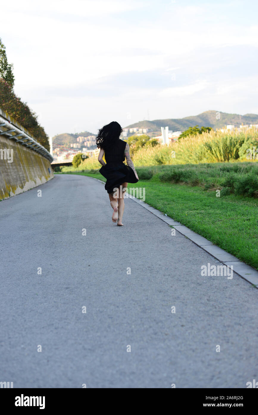 Woman running away escape hi-res stock photography and images - Alamy