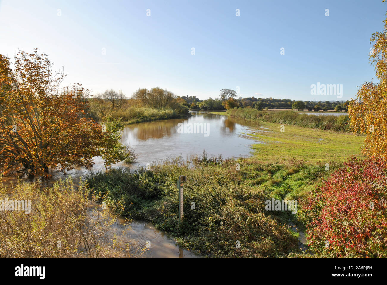 A swollen River Severn in Shropshire showing depth marker Stock Photo Alamy