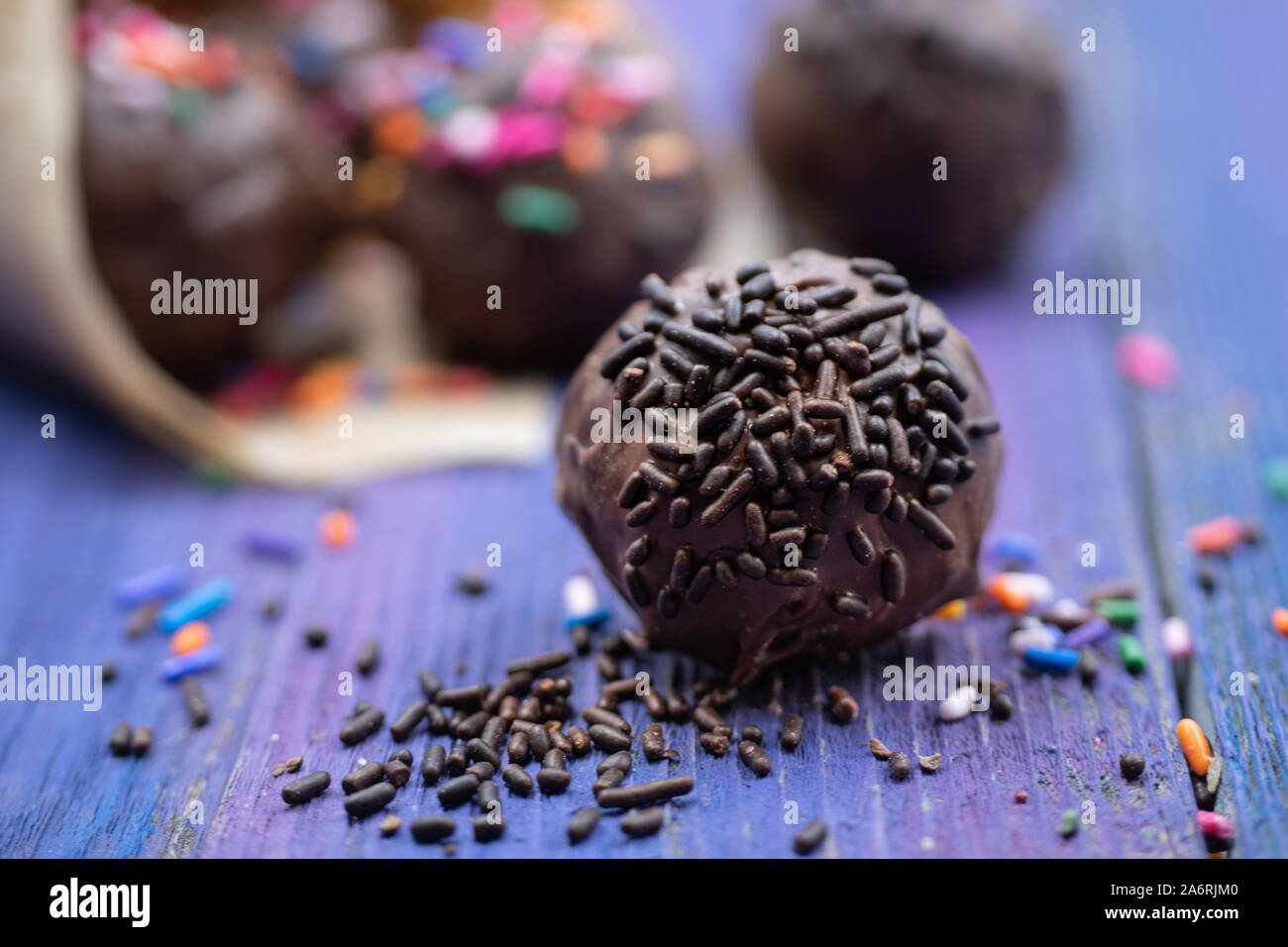 Chocolate donut holes with sprinkles Stock Photo Alamy