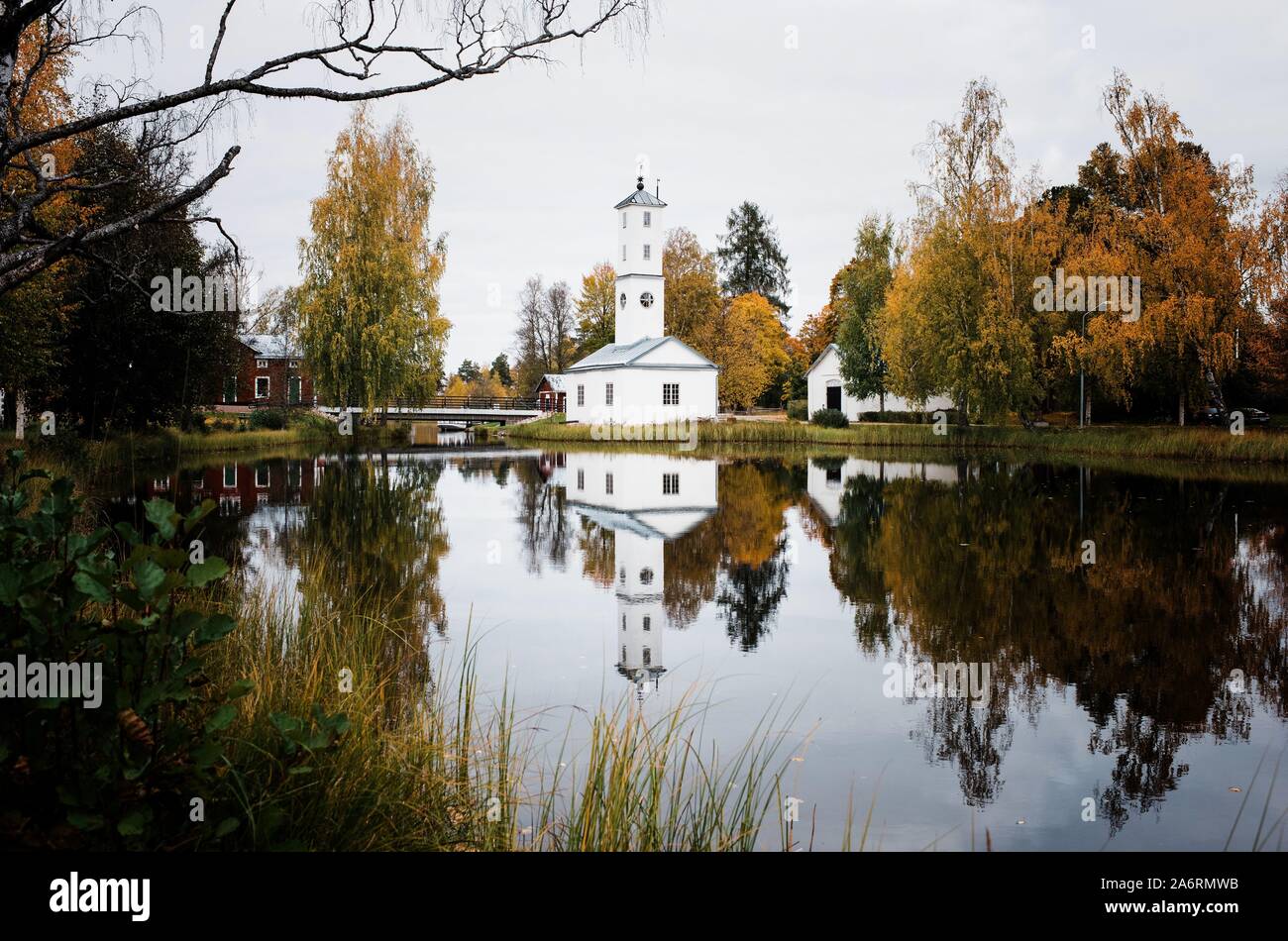 reflection of a Traditional Swedish building in a lake in Sweden Stock Photo
