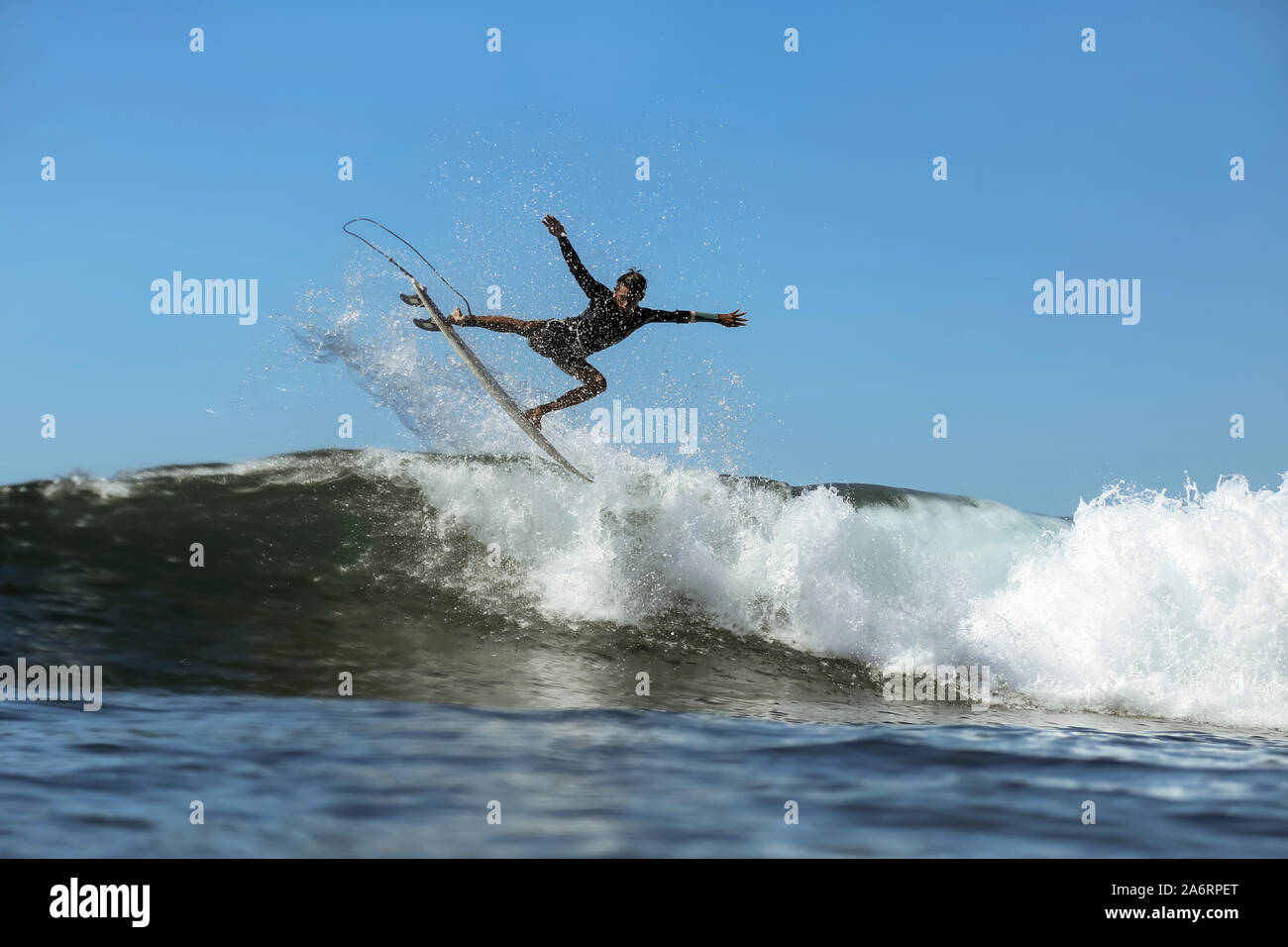 Surfer on a wave Stock Photo