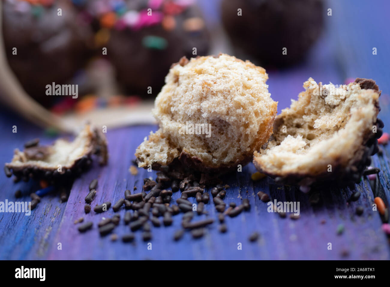 Chocolate donut holes with sprinkles Stock Photo Alamy