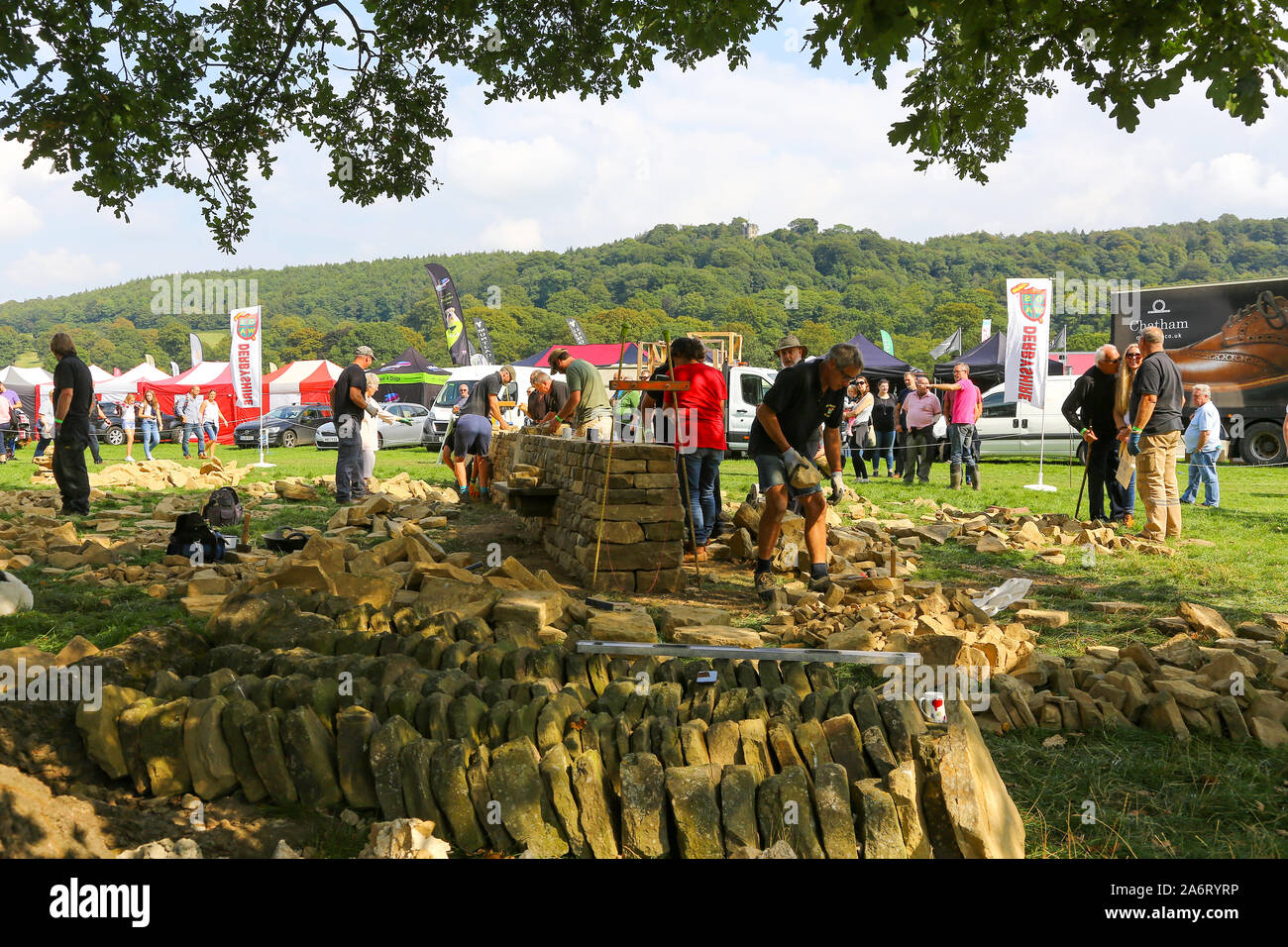 A dry stone wall making demonstration at the Chatsworth Game or Country Fair, Chatsworth House, Derbyshire, England, UK Stock Photo