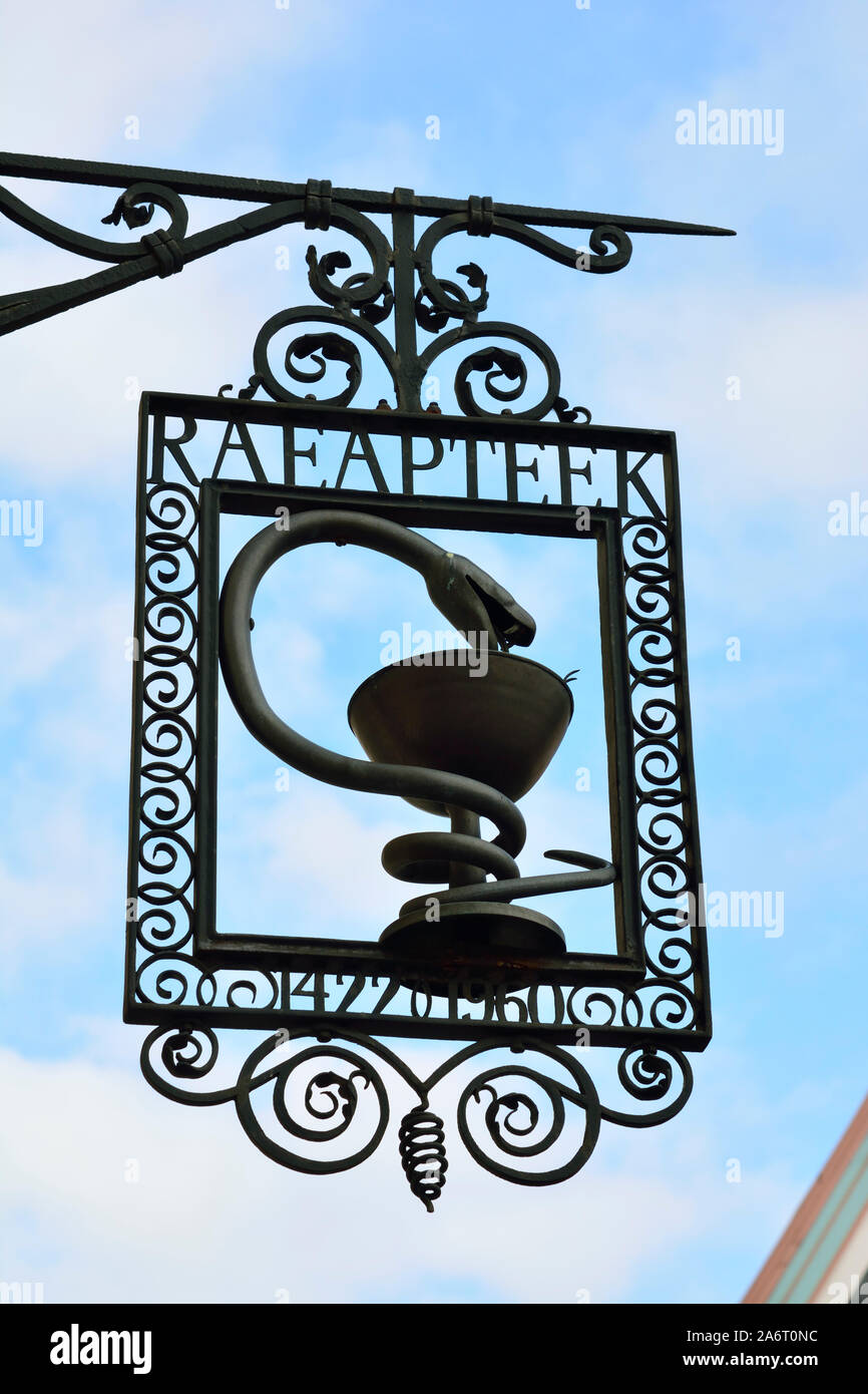 Pharmacy sign of the Raeapteek, one of the oldest continuously running pharmacies in Europe, having always been in business in the same house since 14 Stock Photo