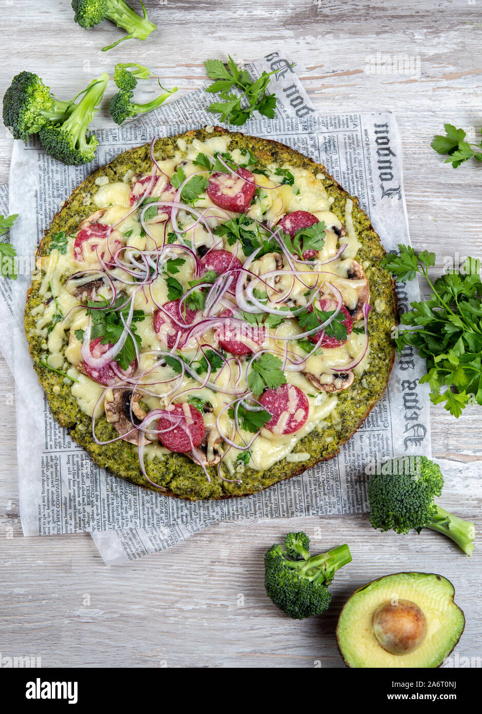 Crust Broccoli base low carbs keto pizza with salami, avocado on
