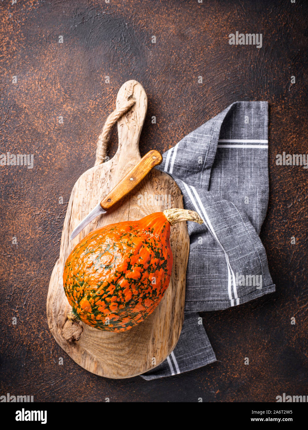 Raw hokkaido pumpkins on rusty background Stock Photo - Alamy
