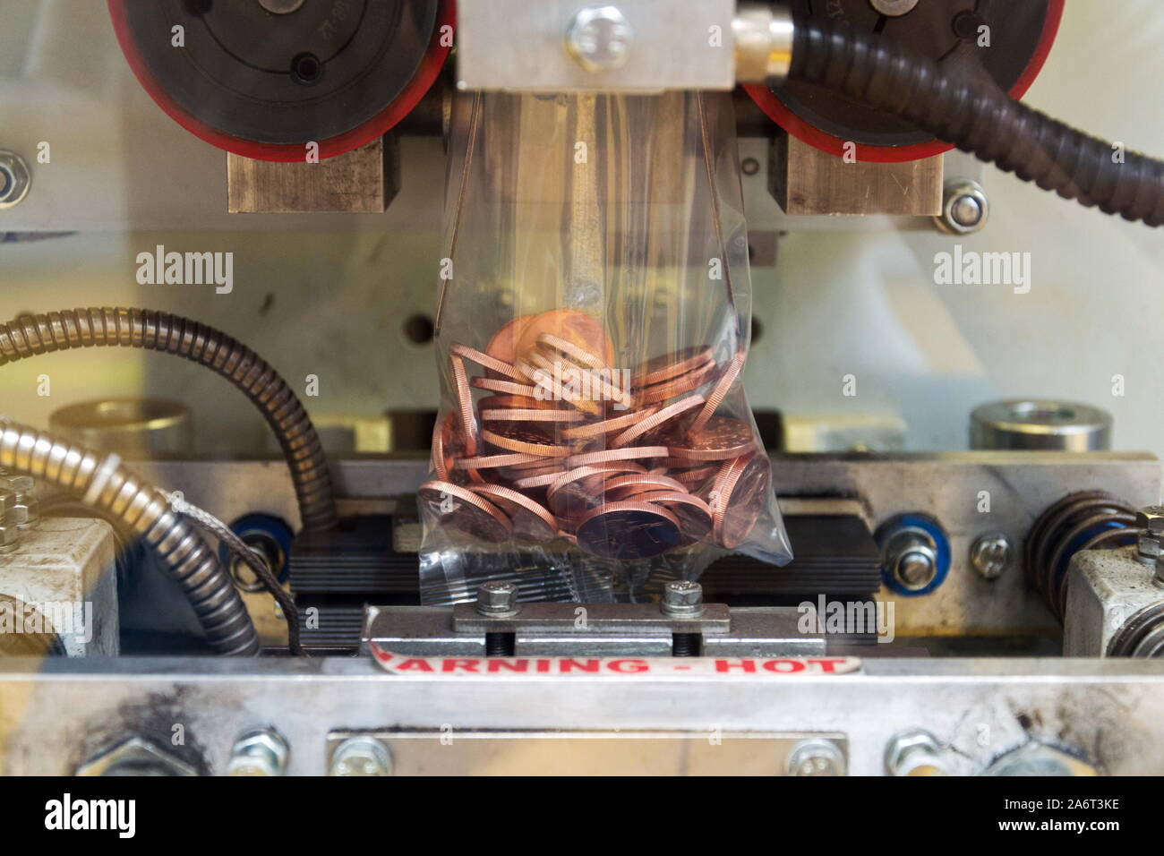 Coin minting machine hires stock photography and images Alamy