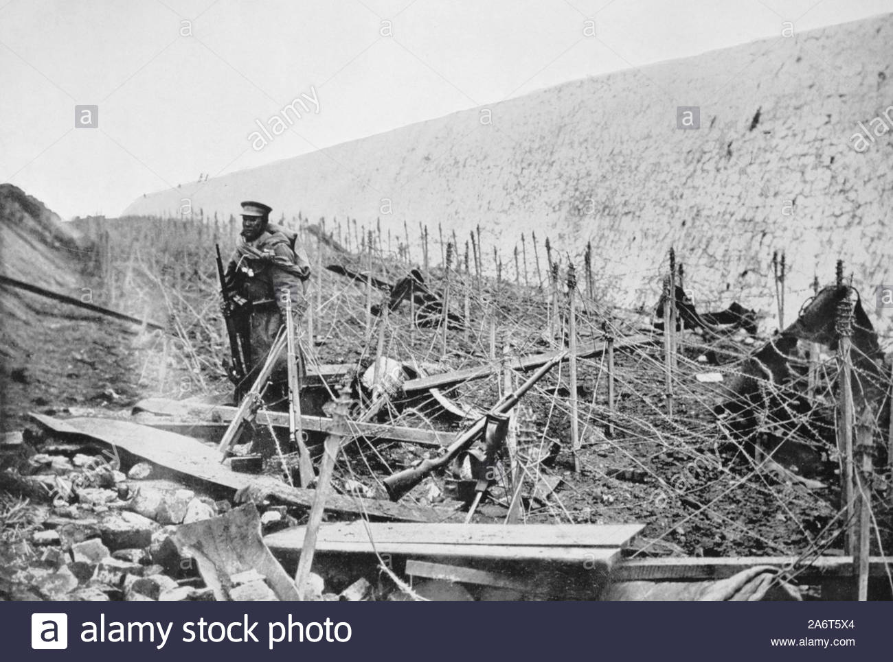 WW1 Barbed wire fence in a fort ditch at Tsingtao China during the siege, vintage photograph from 1914 Stock Photo