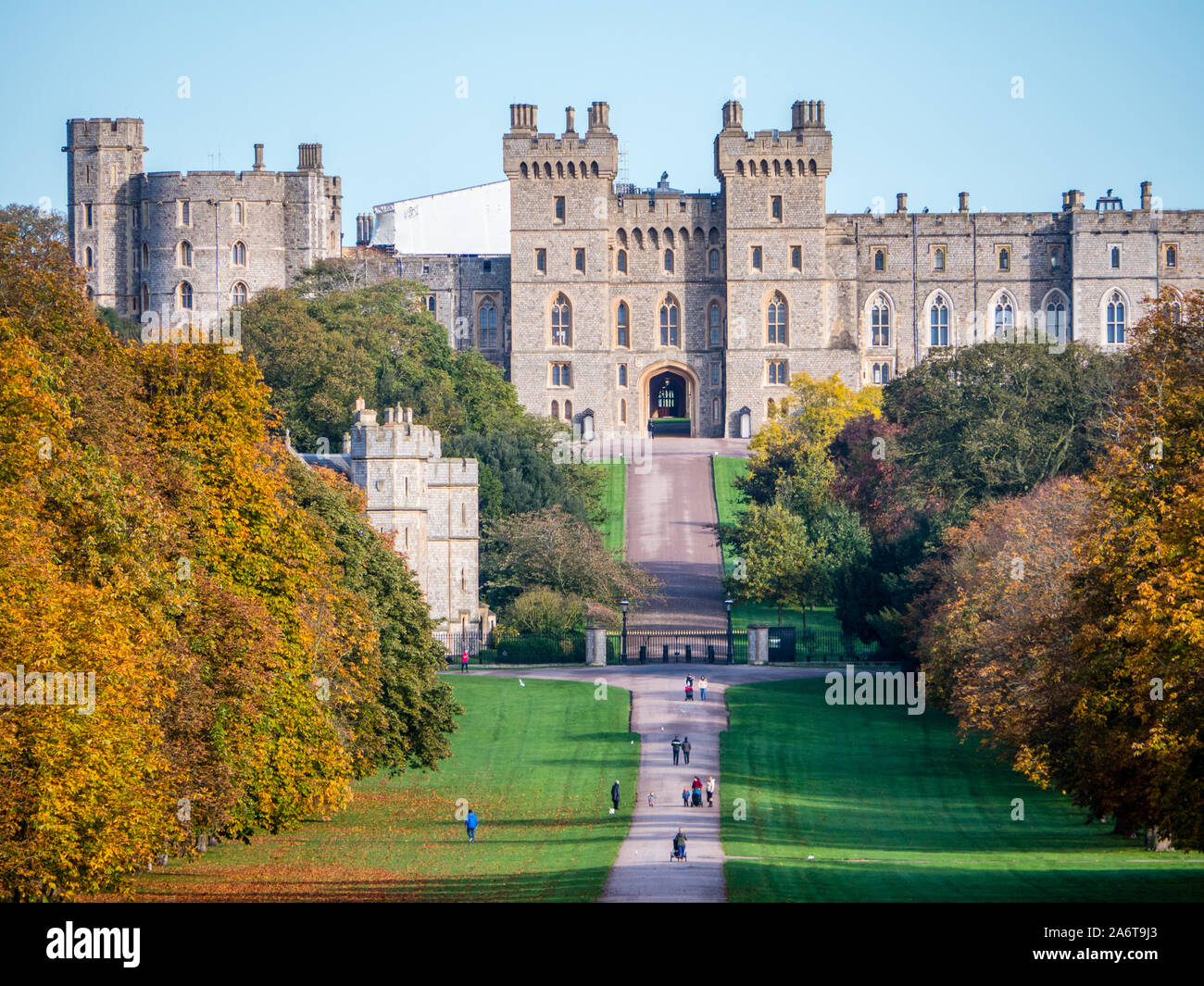 Autumn Landscape of Royal Windsor Castle, with people Walking on the Long Walk in Windsor Great Park, Berkshire, England, UK, GB. Stock Photo