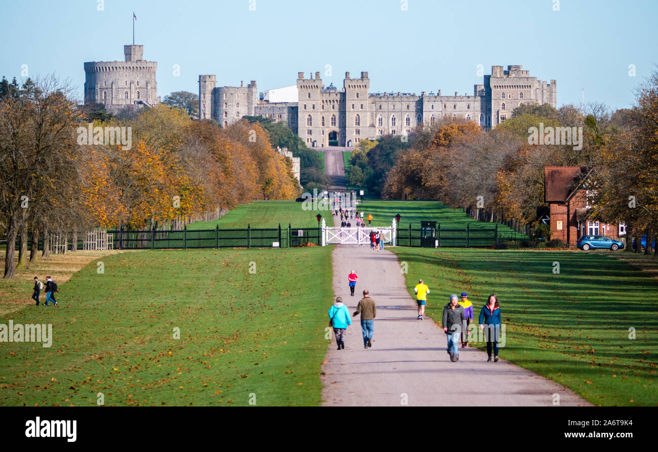 Autumn Landscape of Royal Windsor Castle, with people Walking on the Long Walk in Windsor Great Park, Berkshire, England, UK, GB. Stock Photo