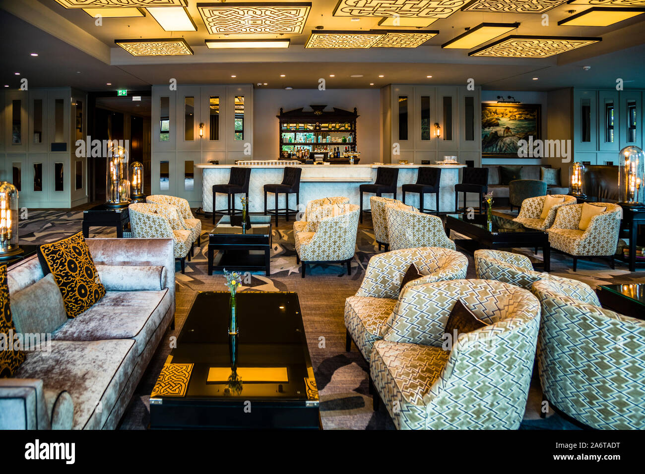 A lounge at the five-star Dunloe Hotel & Gardens near Killarney, County Kerry, Ireland, offers guests comfortable seating. Stock Photo