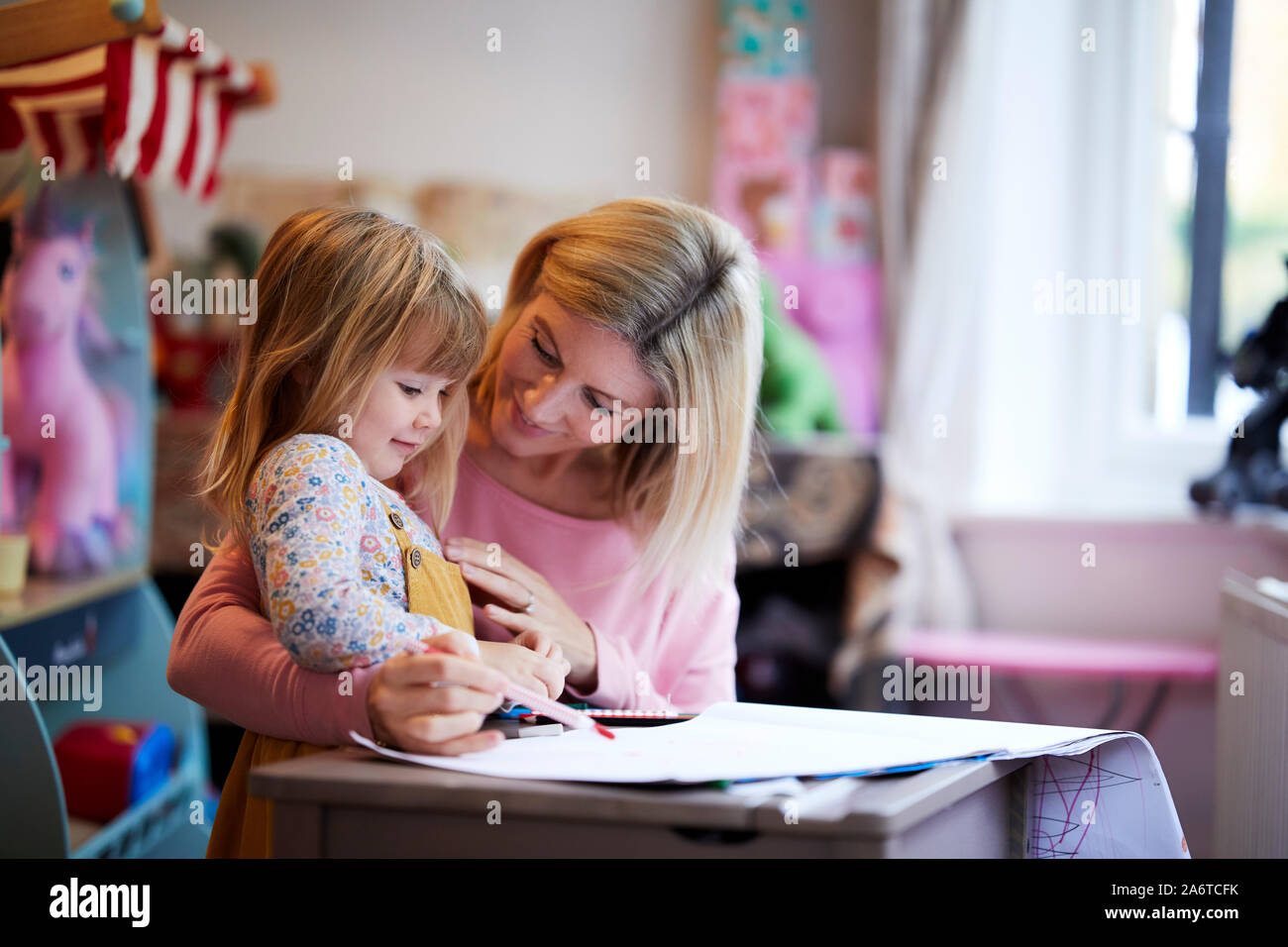 Mum and daughter drawing together Stock Photo